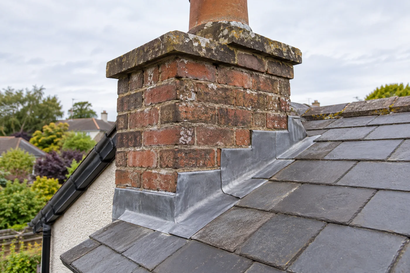 Brick chimney pointing and lead apron