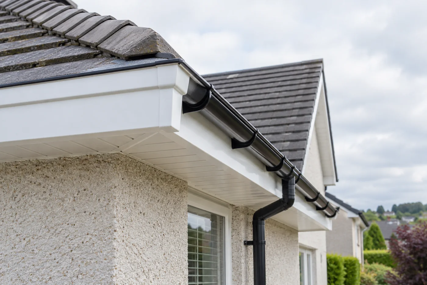 Fascia and soffit beneath tiled domestic eaves